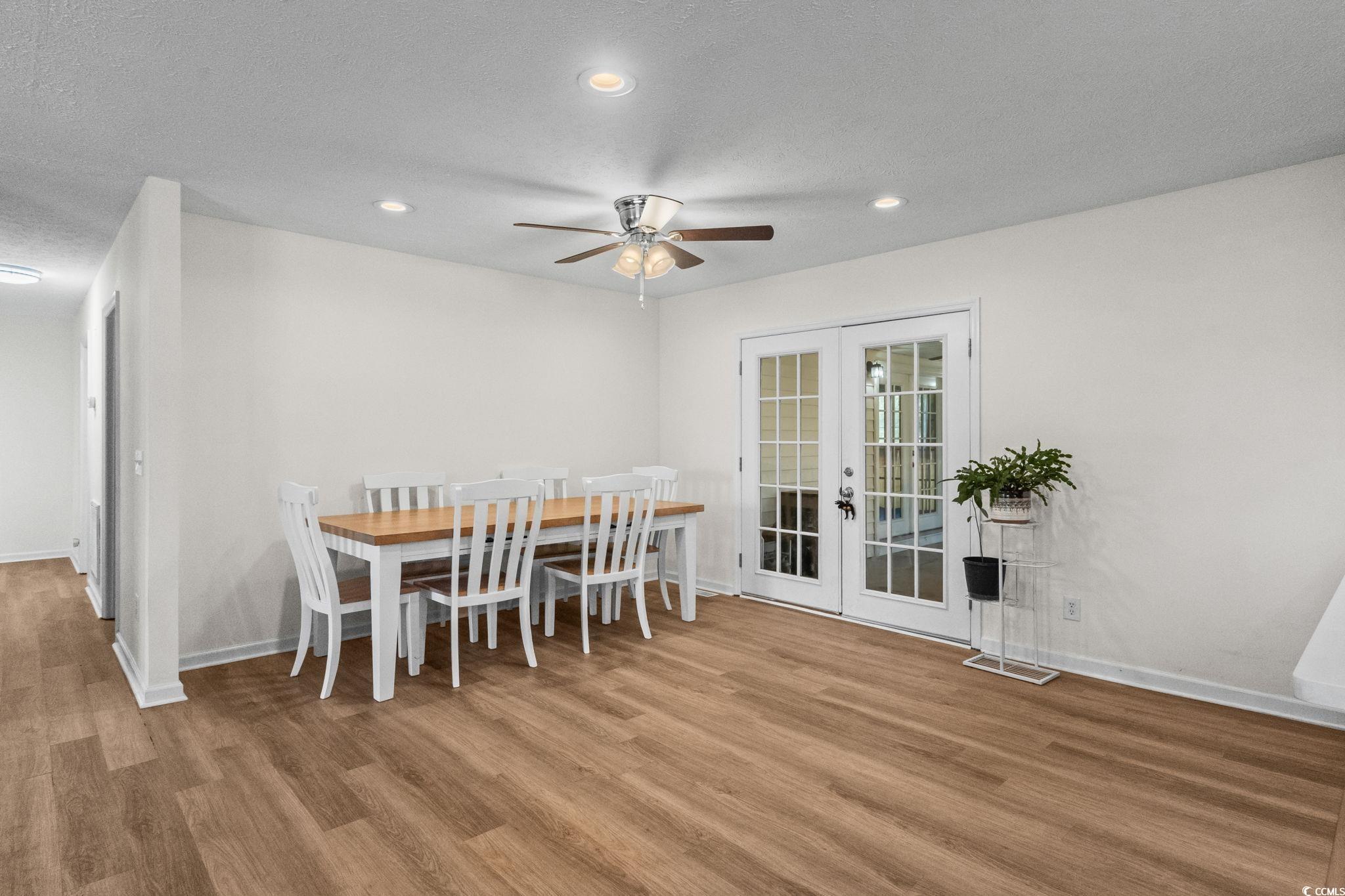 1996 Heritage Road Loris, SC 29569 - Photo 16 of 40 Dining area with recessed lighting, a textured ceiling, french doors, light wood-type flooring, and a ceiling fan