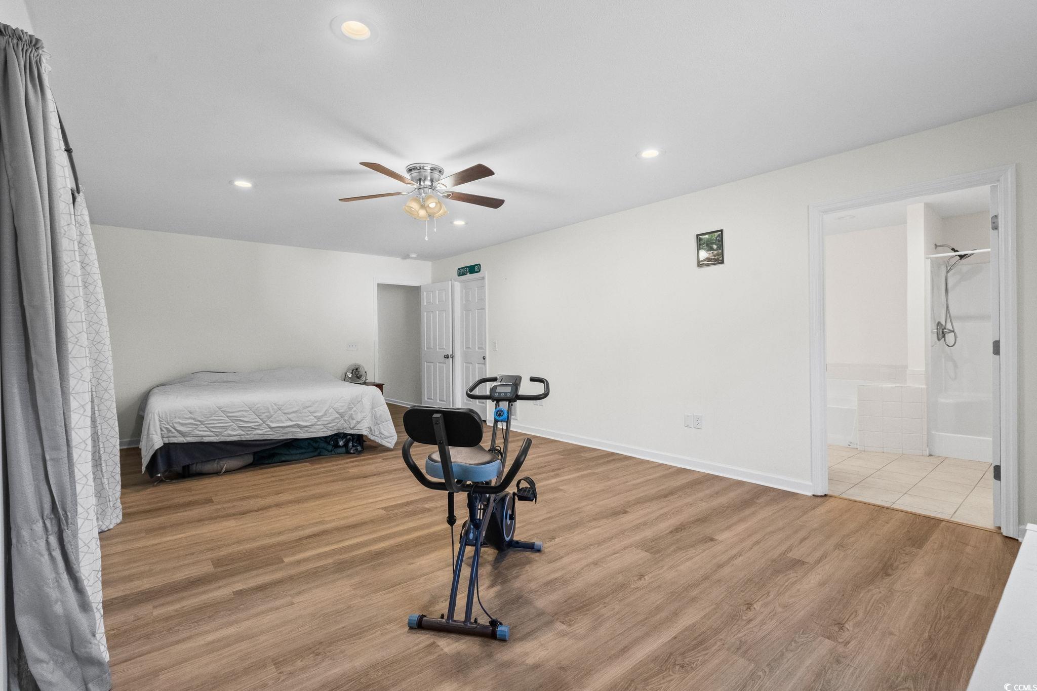 1996 Heritage Road Loris, SC 29569 - Photo 18 of 40 Bedroom with light wood-type flooring, recessed lighting, ceiling fan, and ensuite bathroom