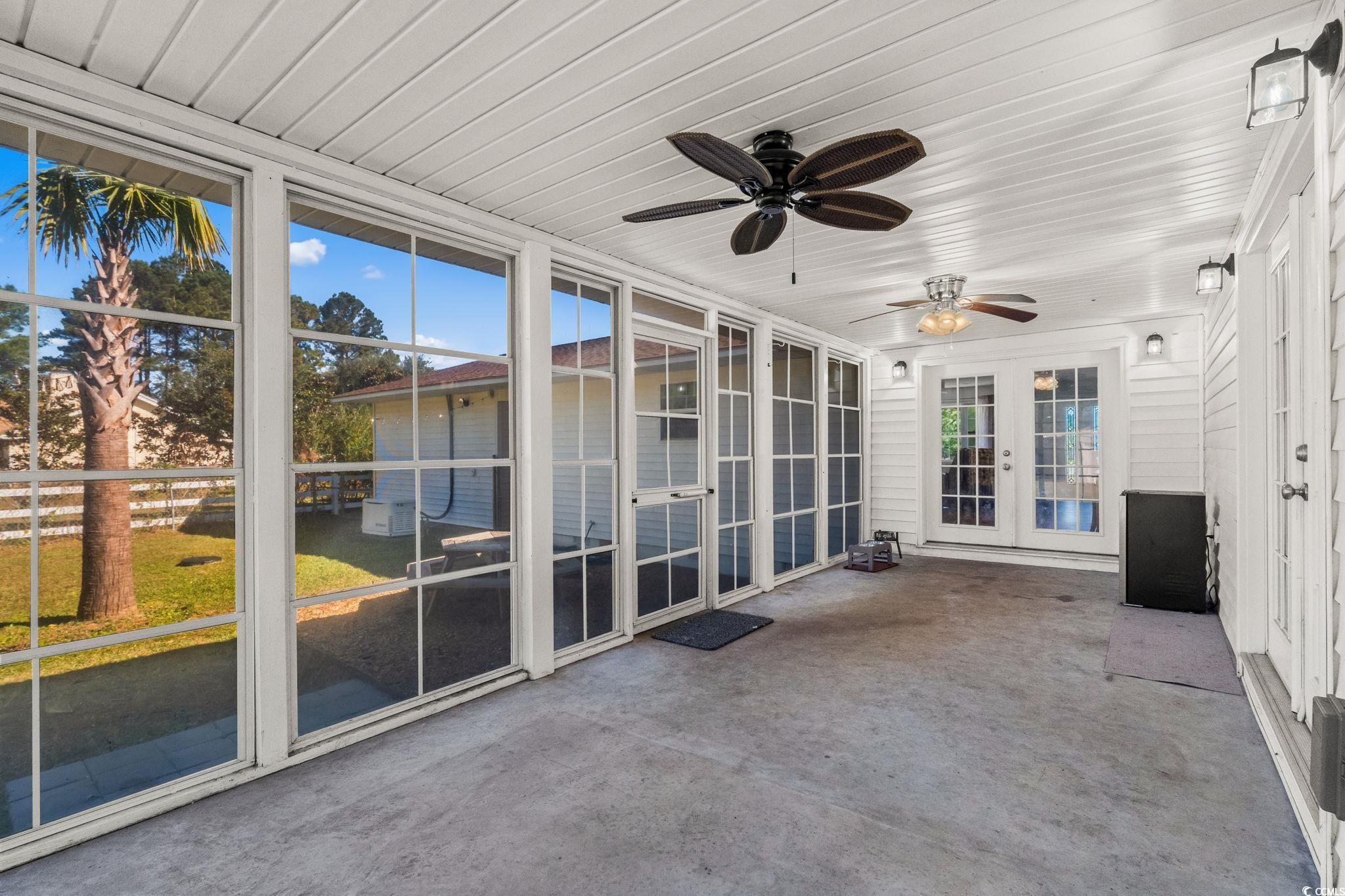 1996 Heritage Road Loris, SC 29569 - Photo 29 of 40 Unfurnished sunroom with a ceiling fan