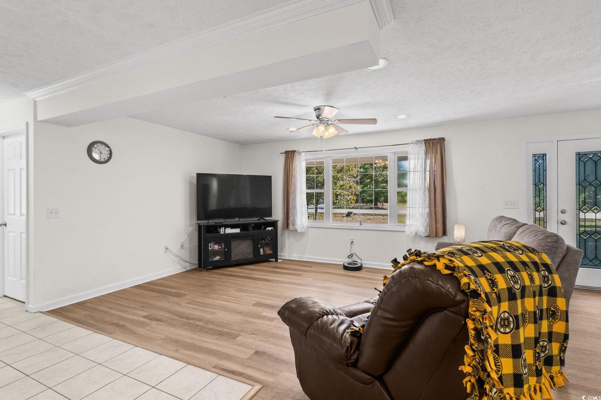 1996 Heritage Road Loris, SC 29569 - Photo 8 of 40 Living area with a textured ceiling, light wood finished floors, a ceiling fan, and recessed lighting