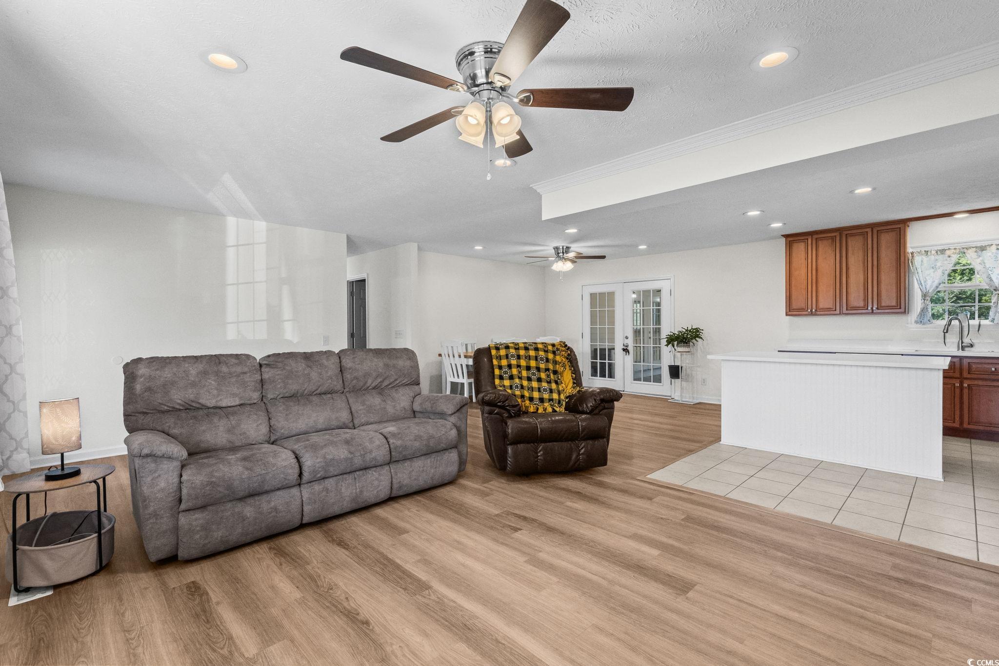 1996 Heritage Road Loris, SC 29569 - Photo 10 of 40 Living room featuring french doors, recessed lighting, light wood-style floors, a textured ceiling, and a ceiling fan