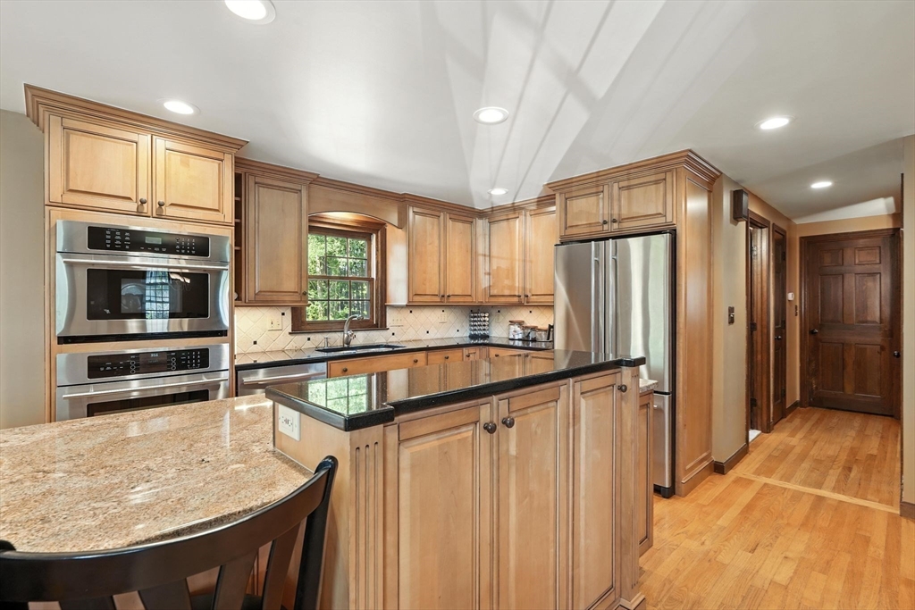 53 Yankee Circle Westfield, MA 01085 - Photo 11 of 42 a kitchen with stainless steel appliances granite countertop a refrigerator and a stove top oven