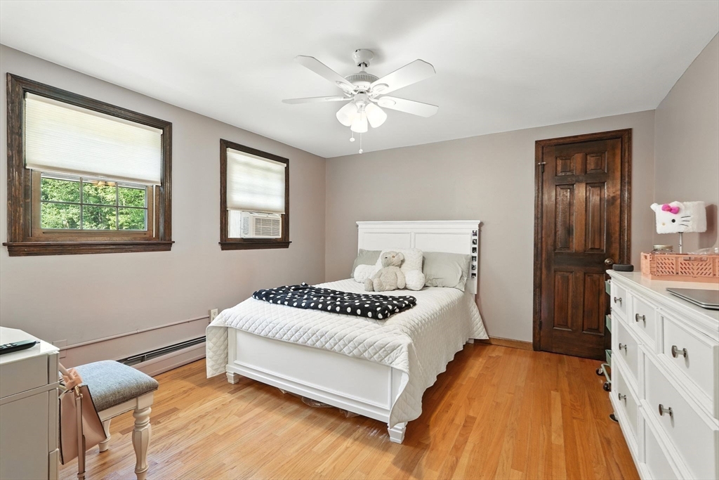 53 Yankee Circle Westfield, MA 01085 - Photo 19 of 42 a spacious bedroom with a bed and a chandelier