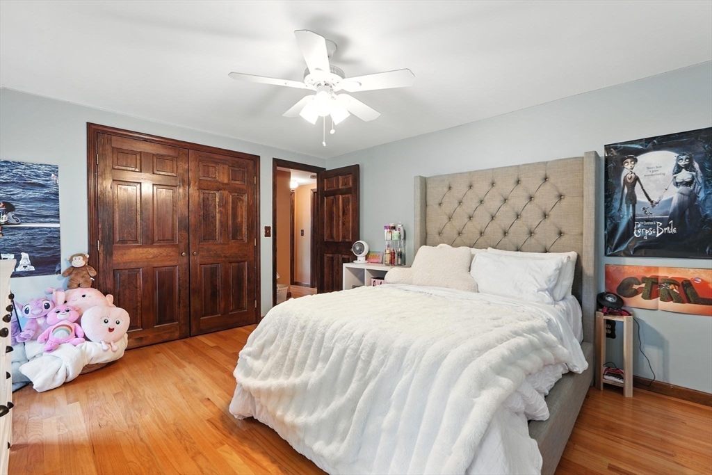 53 Yankee Circle Westfield, MA 01085 - Photo 24 of 42 a spacious bedroom with a bed and a chandelier