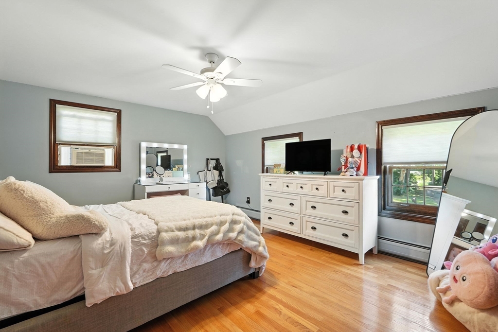 53 Yankee Circle Westfield, MA 01085 - Photo 25 of 42 a bedroom with a bed a flat screen tv and a dresser