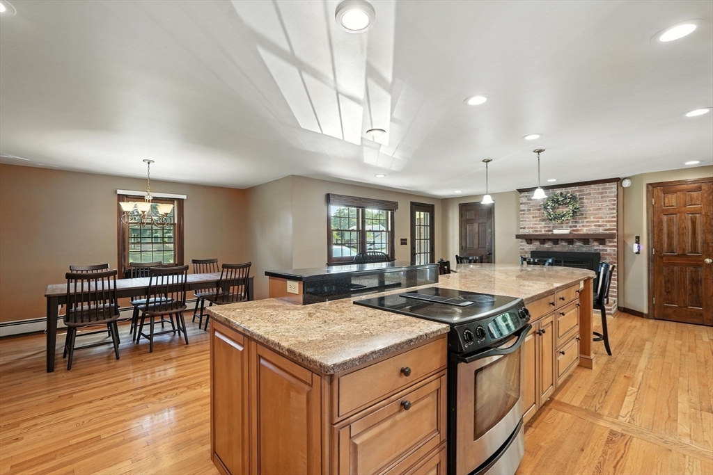 53 Yankee Circle Westfield, MA 01085 - Photo 10 of 42 a kitchen with a stove and chairs