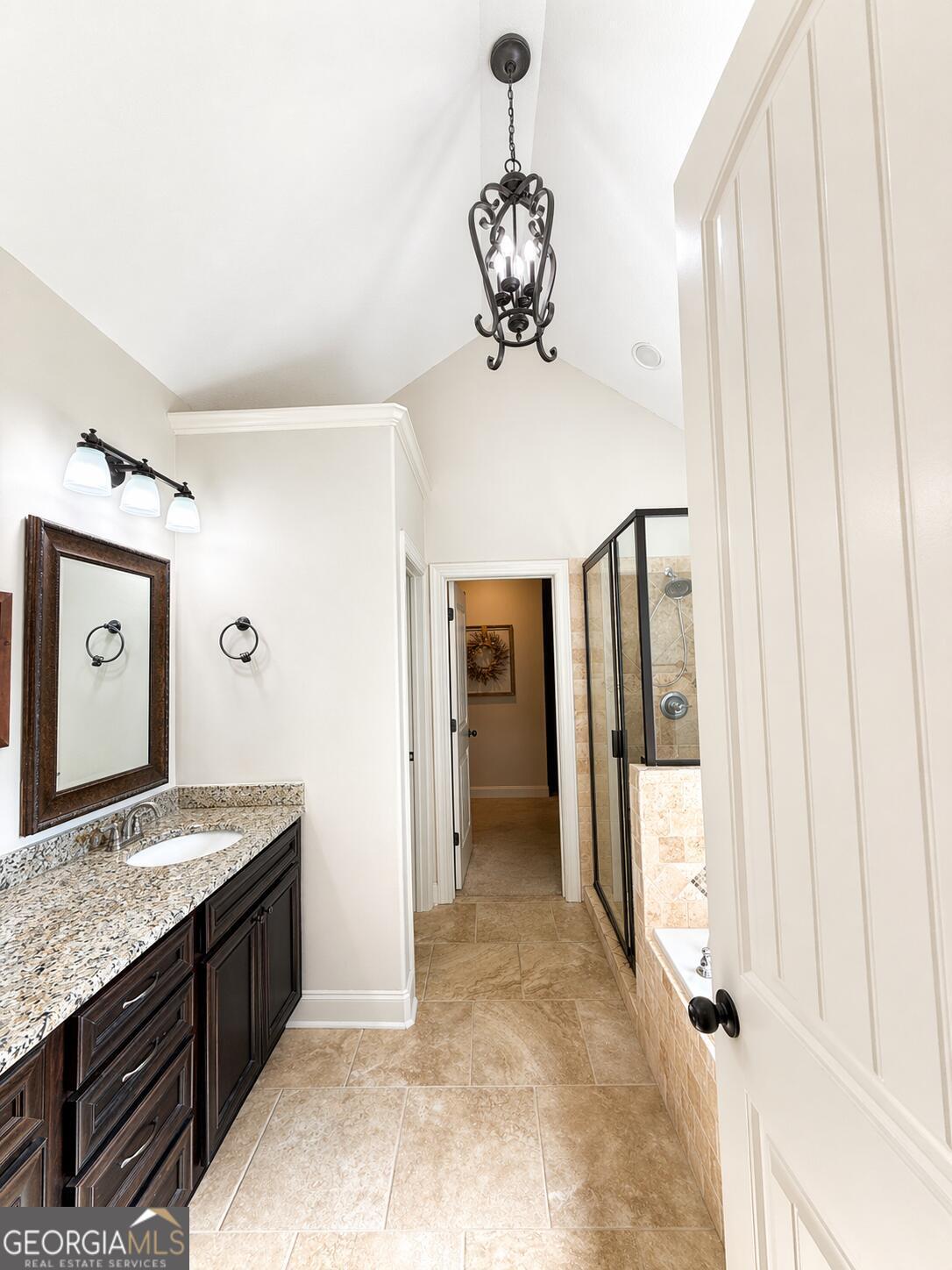106 Rawlins Point Perry, GA 31069 - Photo 12 of 34 a spacious bathroom with a granite countertop sink and a mirror