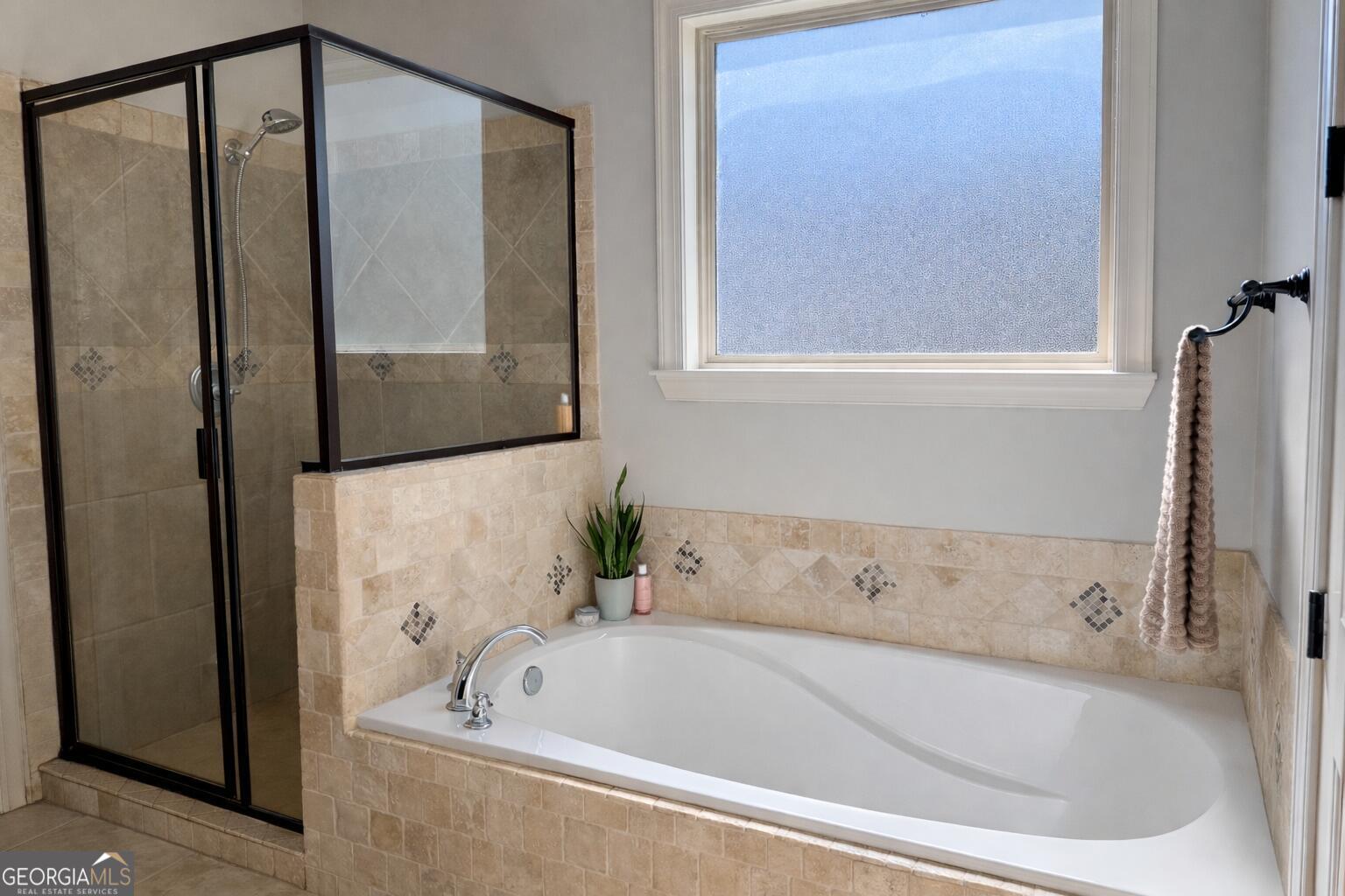 106 Rawlins Point Perry, GA 31069 - Photo 13 of 34 a bathroom with a bathtub and a shower