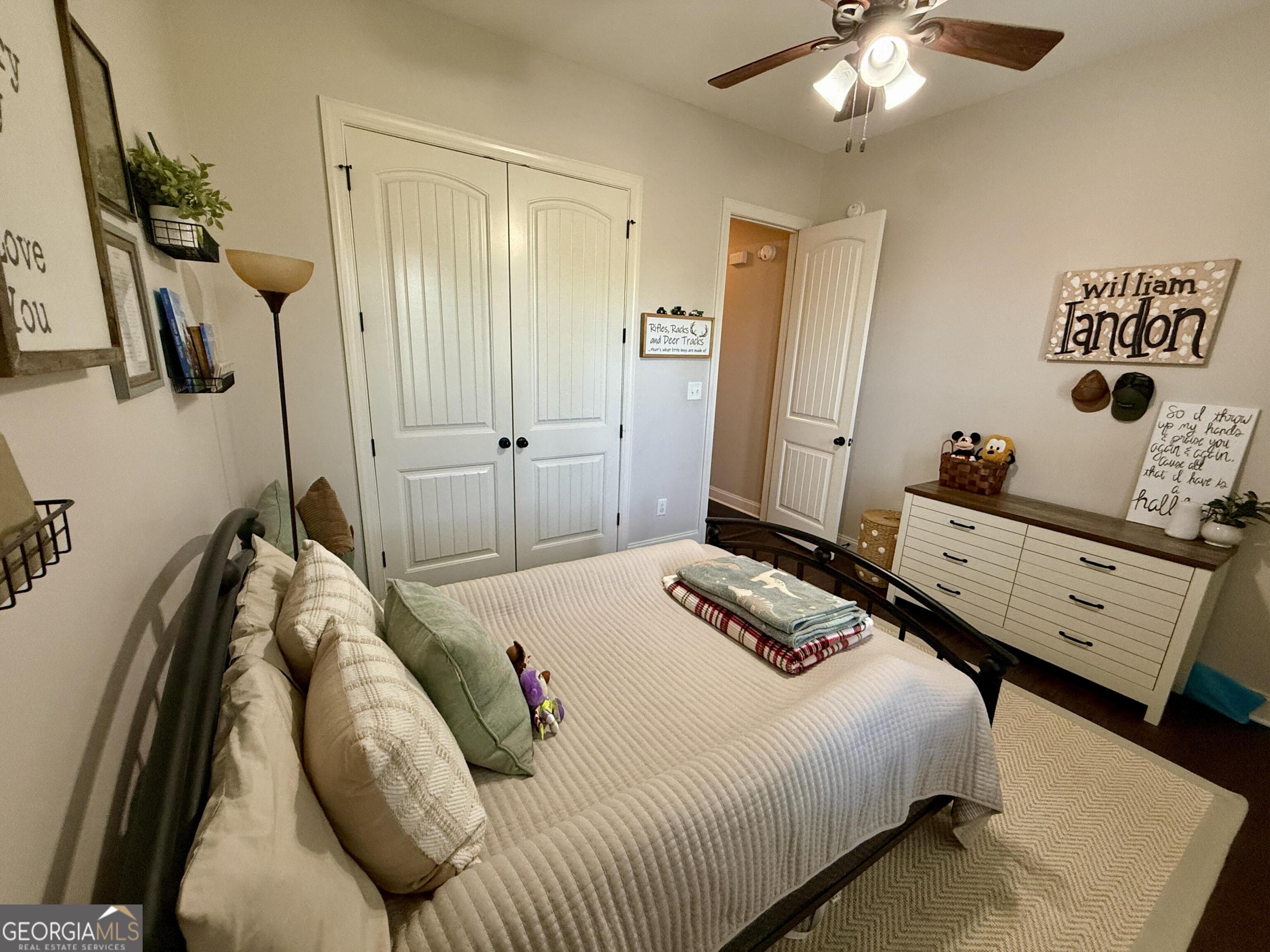 106 Rawlins Point Perry, GA 31069 - Photo 18 of 34 a bedroom with a bed and ceiling fan