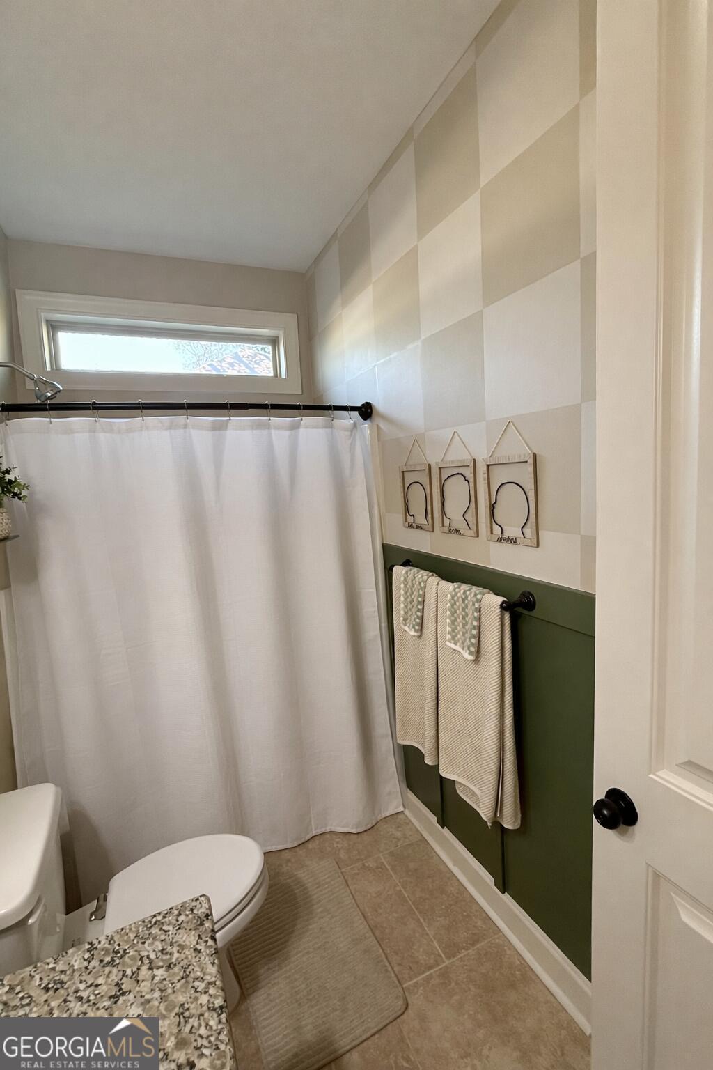 106 Rawlins Point Perry, GA 31069 - Photo 22 of 34 a bathroom with a toilet and shower