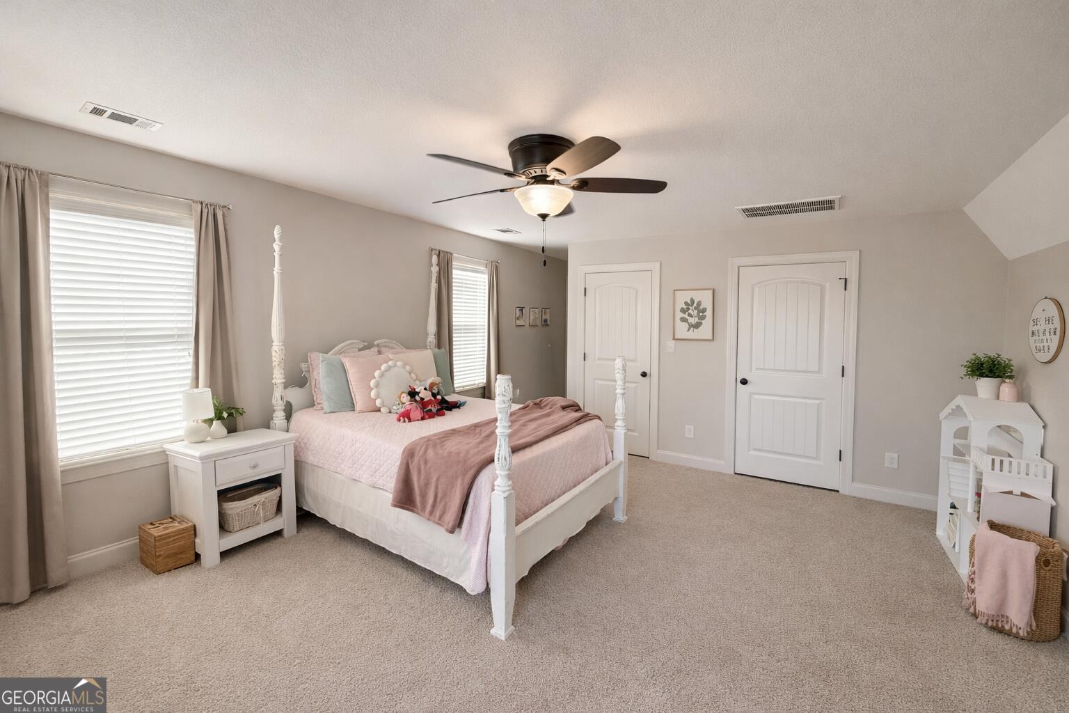 106 Rawlins Point Perry, GA 31069 - Photo 25 of 34 a bedroom with a bed and a ceiling fan