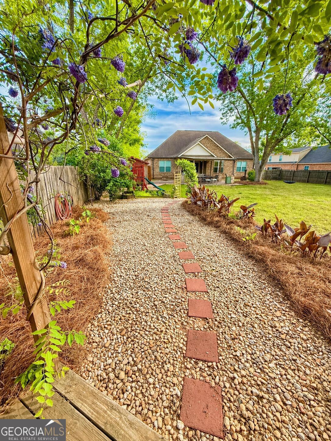 106 Rawlins Point Perry, GA 31069 - Photo 32 of 34 a view of a backyard with a garden