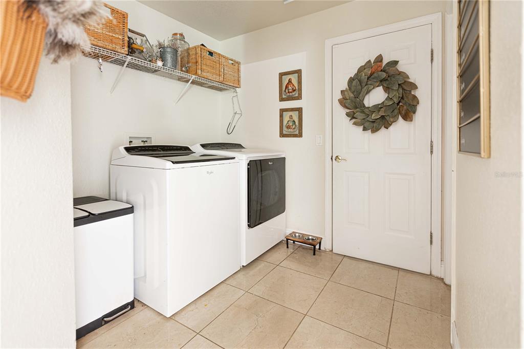1915 Southwest 40th Place Ocala, FL 34471 - Photo 15 of 20 a view of a storage & utility room with dryer and washer