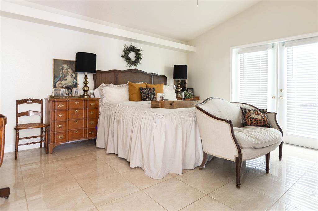 1915 Southwest 40th Place Ocala, FL 34471 - Photo 16 of 20 a bedroom with a bed and dresser