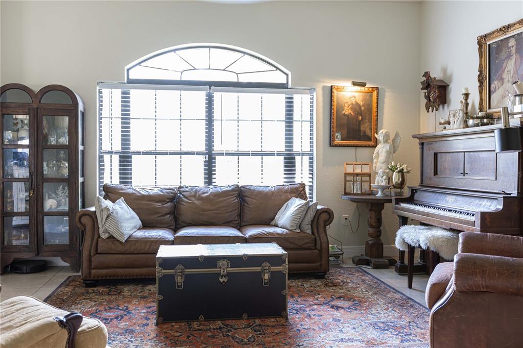 1915 Southwest 40th Place Ocala, FL 34471 - Photo 20 of 20 a living room with furniture and a flat screen tv