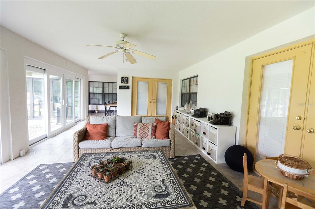 1915 Southwest 40th Place Ocala, FL 34471 - Photo 2 of 20 a living room with furniture and a large window