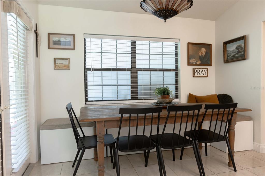 1915 Southwest 40th Place Ocala, FL 34471 - Photo 5 of 20 a view of a dining room with furniture window and wooden floor