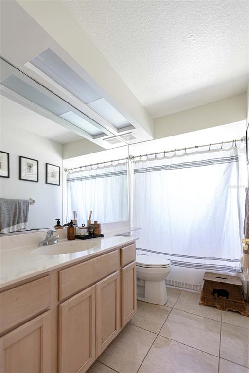 1915 Southwest 40th Place Ocala, FL 34471 - Photo 9 of 20 a bathroom with a sink a toilet and mirror