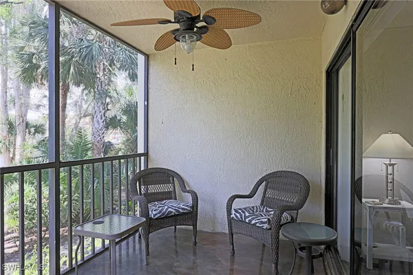 a view of a balcony with furniture