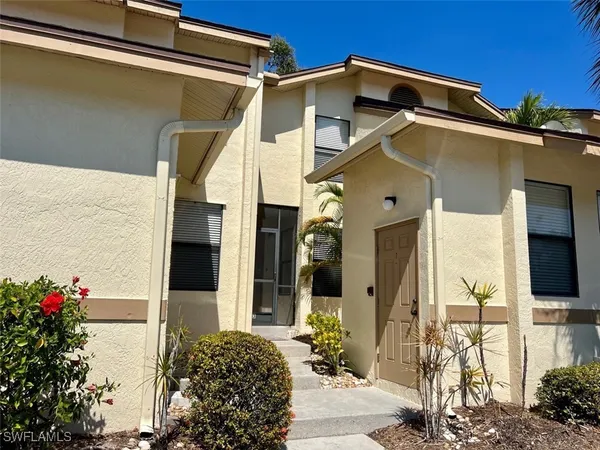 a view of a house with a potted plant
