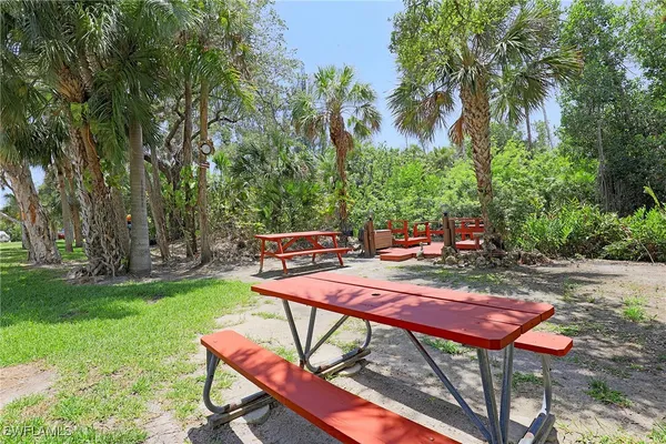 a view of a backyard with sitting area