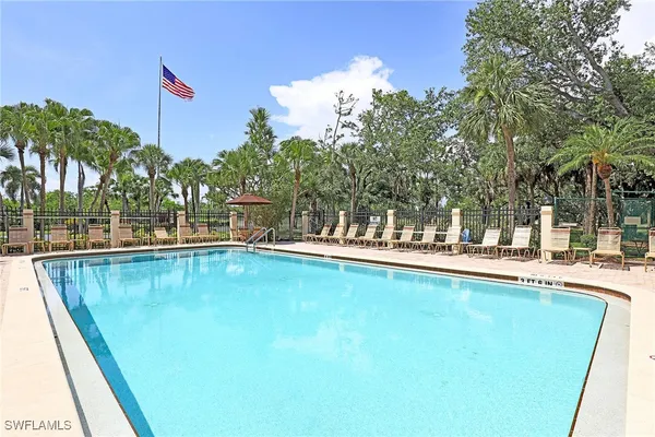 a outdoor view with a swimming pool and sitting space