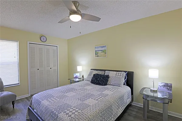 a bedroom with a bed and a table in it