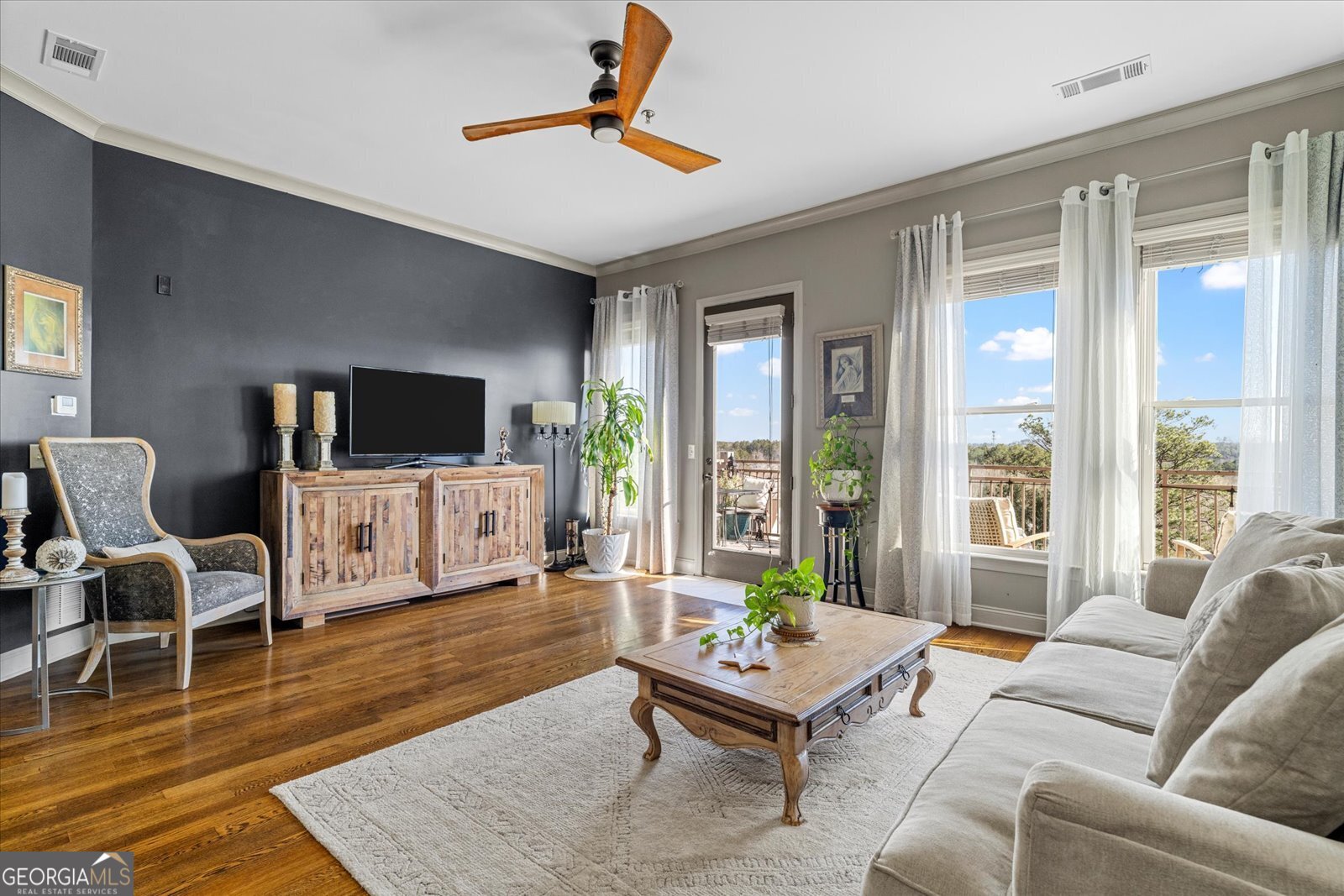 360 Chambers Street Woodstock, GA 30188 - Photo 15 of 50 a living room with furniture and a flat screen tv