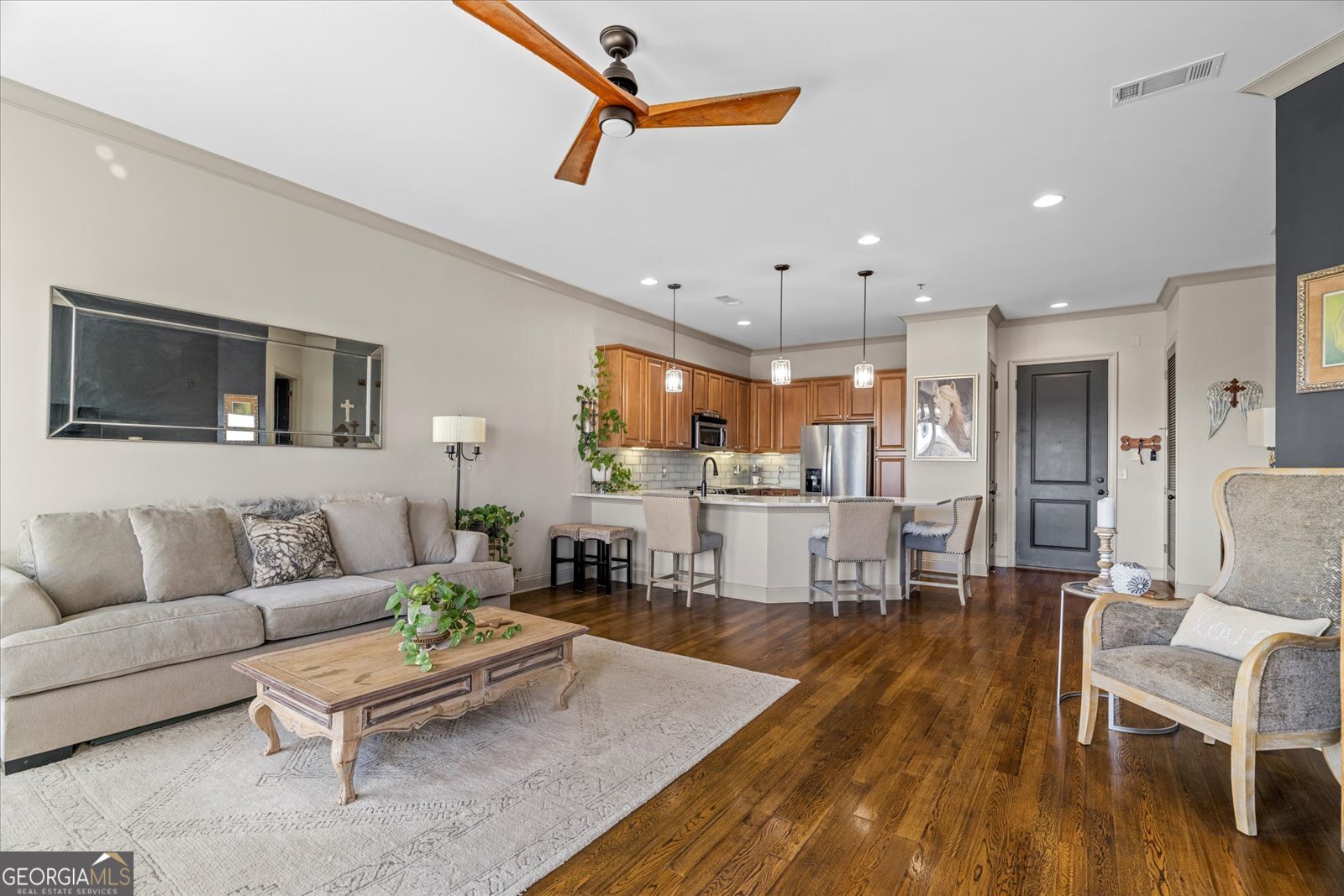360 Chambers Street Woodstock, GA 30188 - Photo 17 of 50 a living room with furniture kitchen view and a wooden floor
