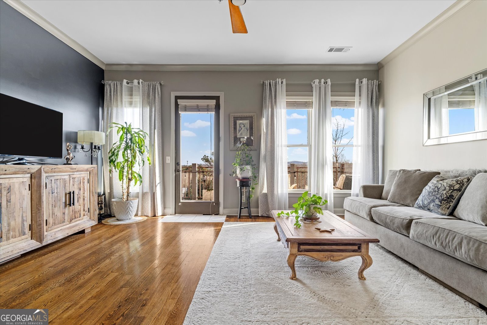 360 Chambers Street Woodstock, GA 30188 - Photo 18 of 50 a living room with furniture and a flat screen tv