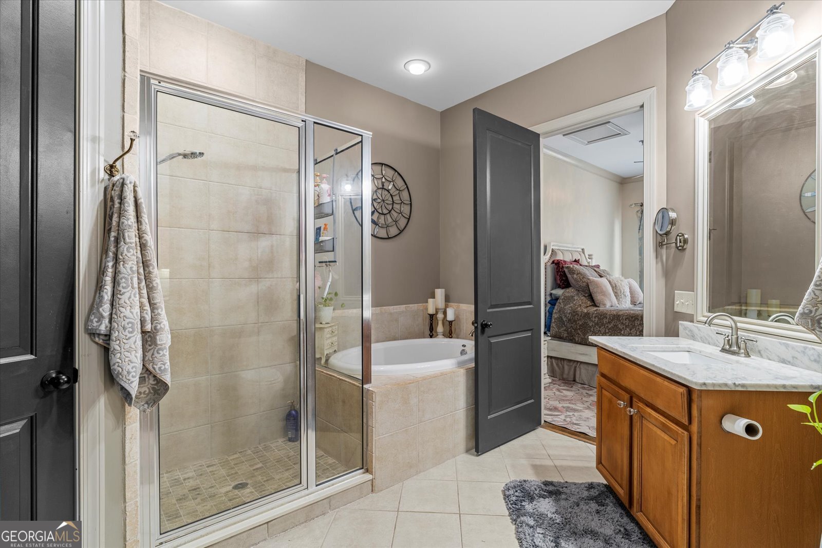 360 Chambers Street Woodstock, GA 30188 - Photo 19 of 50 a bathroom with a tub sink and mirror