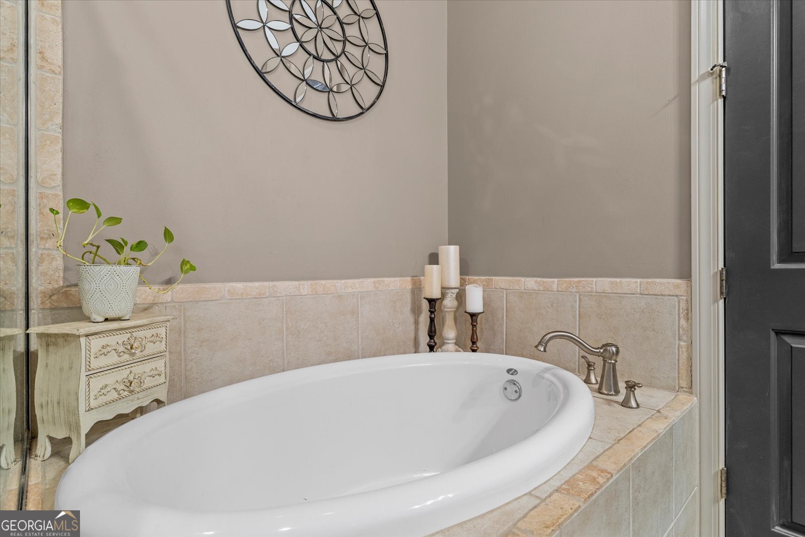 360 Chambers Street Woodstock, GA 30188 - Photo 20 of 50 a white bath tub sitting next to a bathroom sink