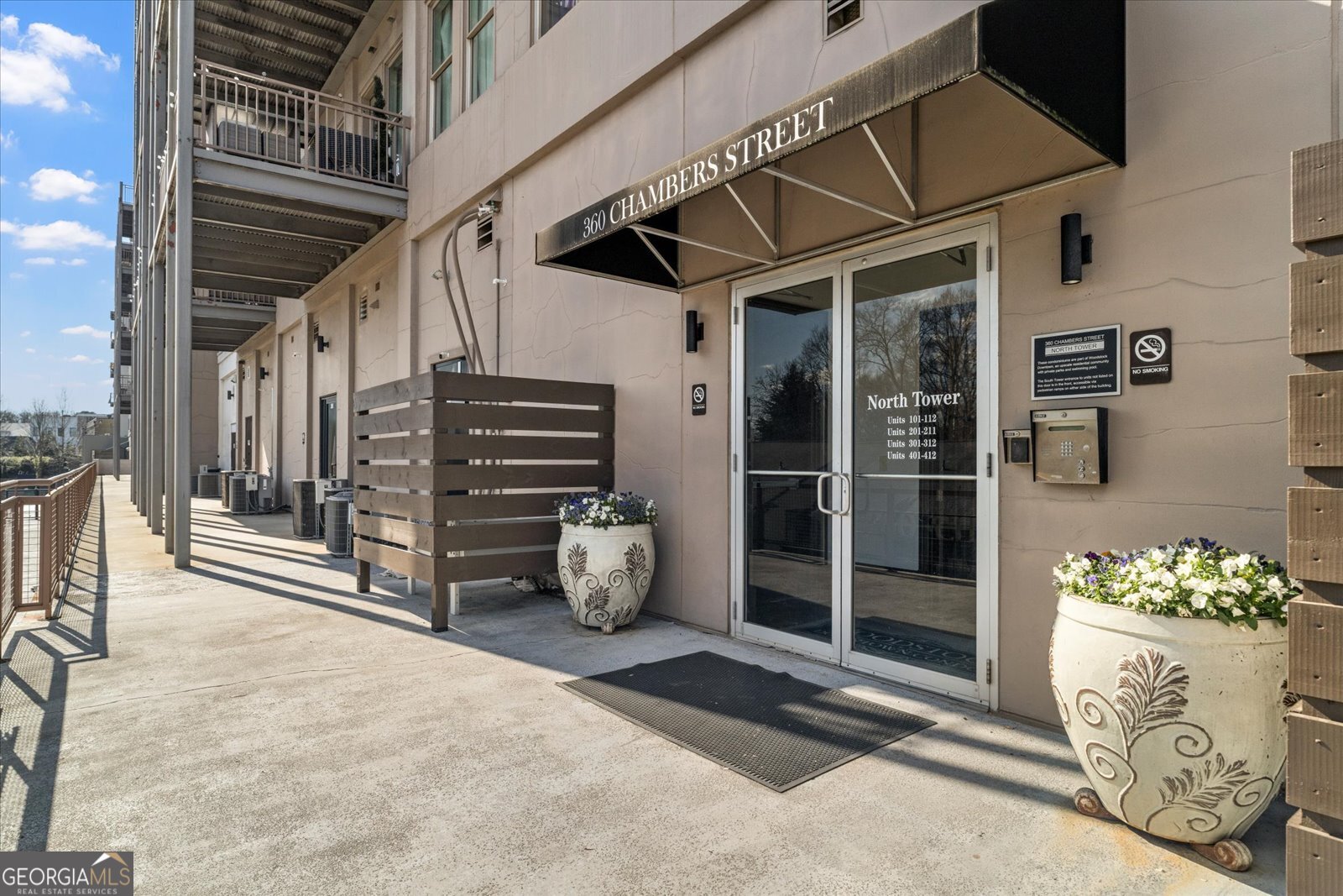 360 Chambers Street Woodstock, GA 30188 - Photo 2 of 50 a view of an entryway with wooden door