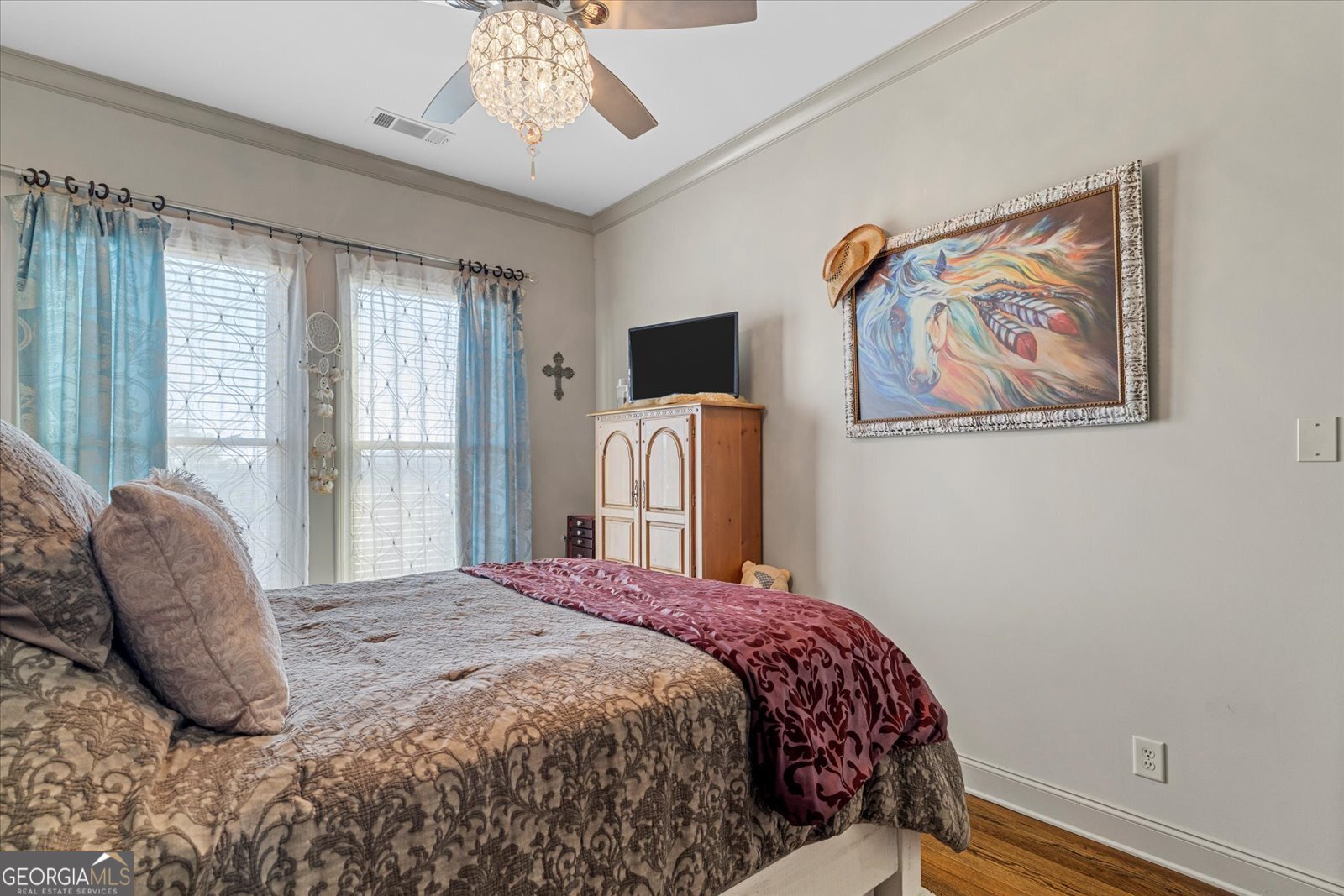 360 Chambers Street Woodstock, GA 30188 - Photo 24 of 50 a bedroom with a bed and a painting on the wall