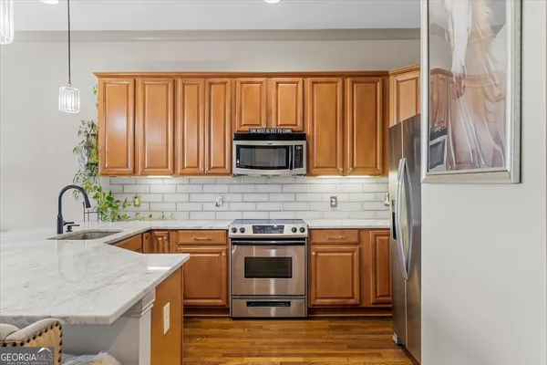 a kitchen with a stove and a sink