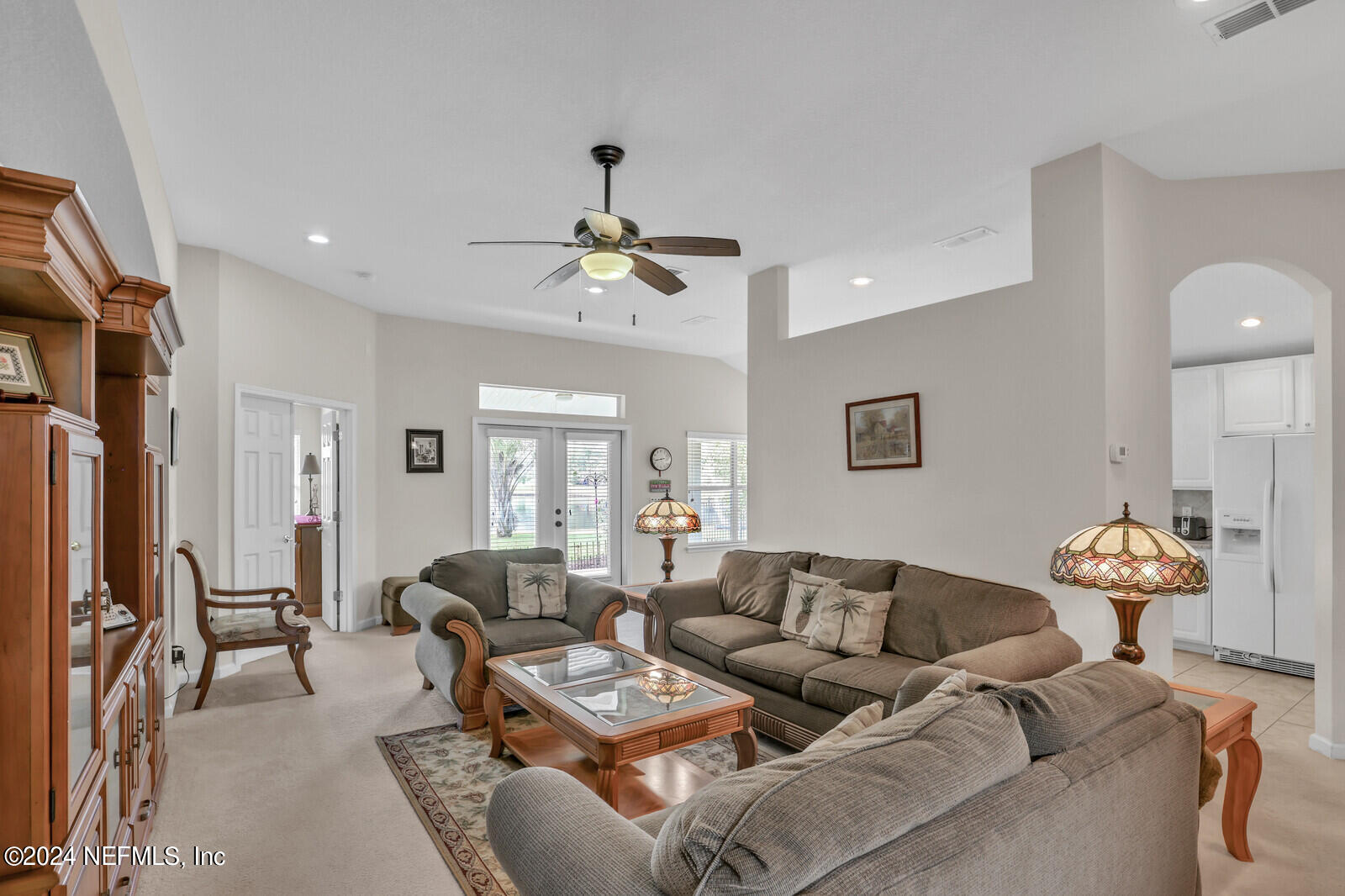 810 East Red House Branch Road St. Augustine, FL 32084 - Photo 11 of 33 a living room with furniture and a chandelier