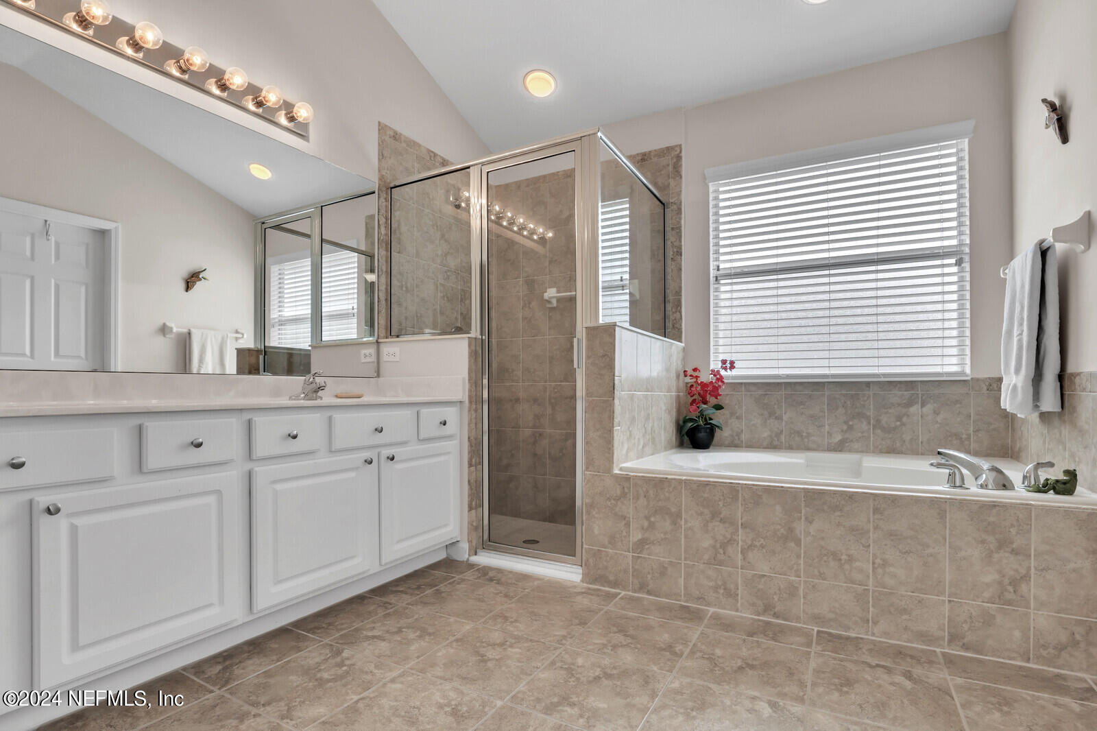 810 East Red House Branch Road St. Augustine, FL 32084 - Photo 21 of 33 a bathroom with a granite countertop sink mirror and bathtub
