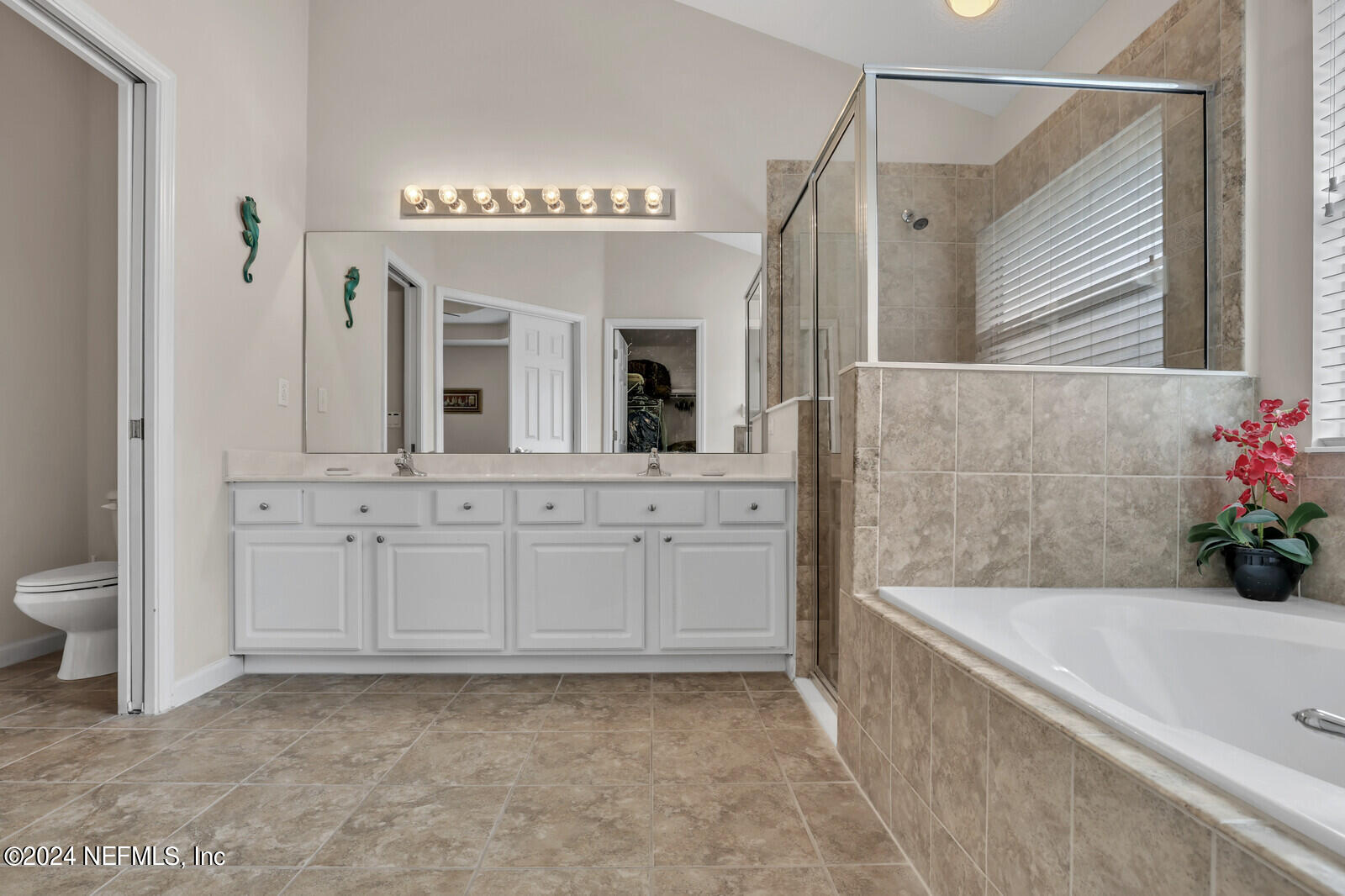 810 East Red House Branch Road St. Augustine, FL 32084 - Photo 23 of 33 a bathroom with a tub sink and mirror