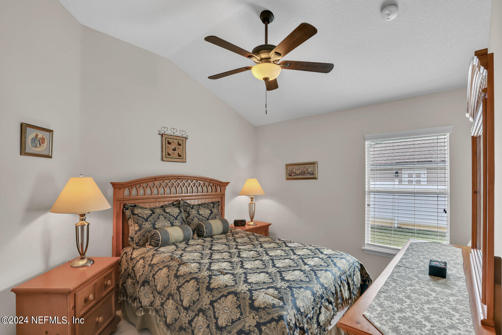 810 East Red House Branch Road St. Augustine, FL 32084 - Photo 25 of 33 a bedroom with a bed and a window