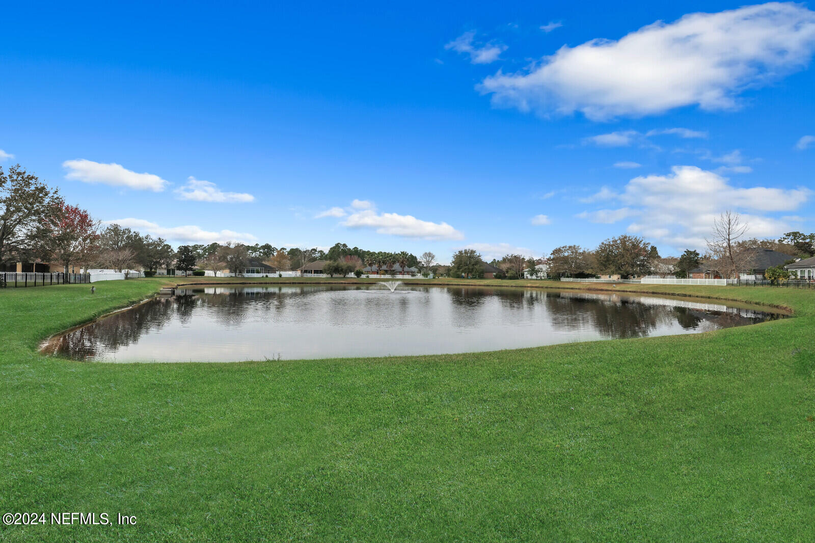 810 East Red House Branch Road St. Augustine, FL 32084 - Photo 31 of 33 a view of a lake with houses in the background