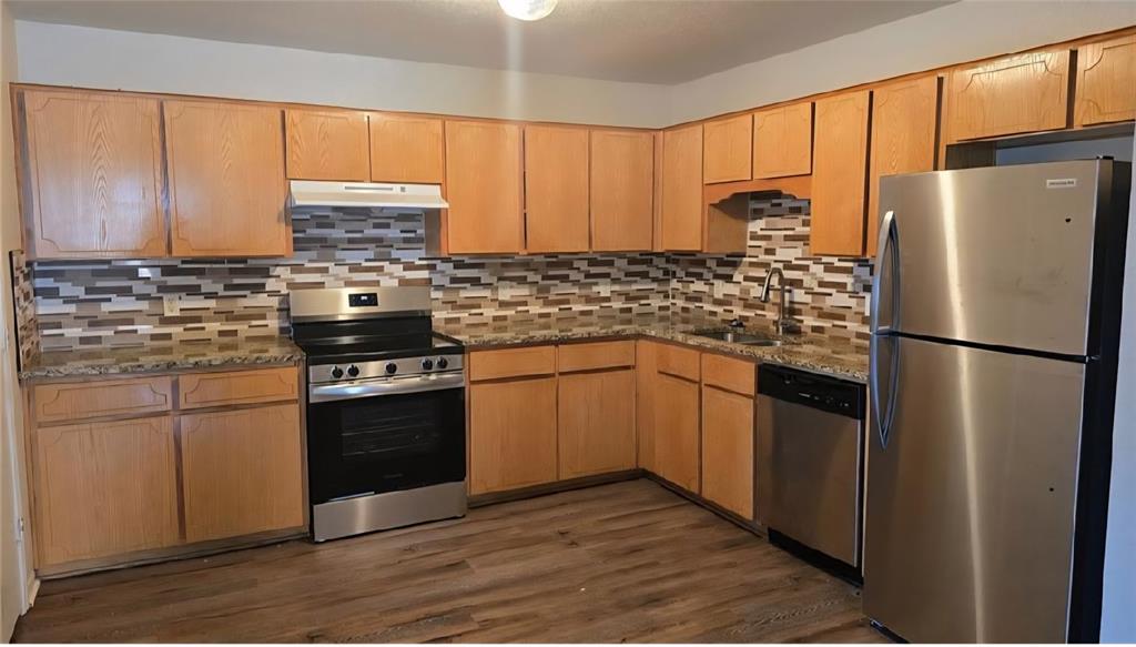 1403 Pima Trail Harker Heights, TX 76548 - Photo 2 of 5 a kitchen with stainless steel appliances granite countertop a refrigerator stove sink and cabinets