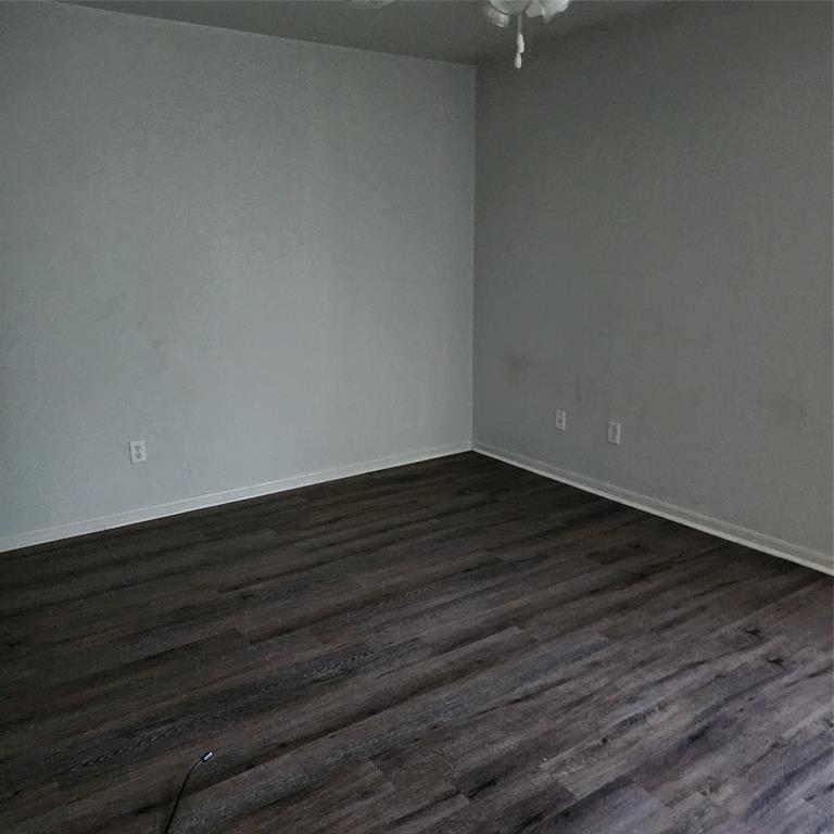 1403 Pima Trail Harker Heights, TX 76548 - Photo 4 of 5 a view of an empty room with wooden floor
