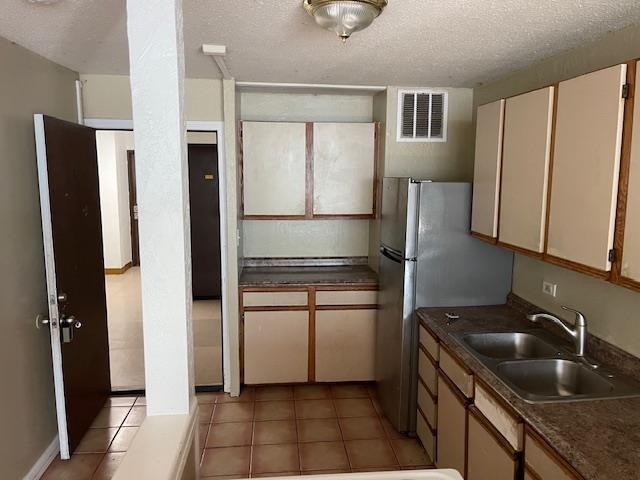 111 Kahului Beach Road, Unit C213 Kahului, HI 96732 - Photo 4 of 8 a kitchen with stainless steel appliances granite countertop a refrigerator and a sink