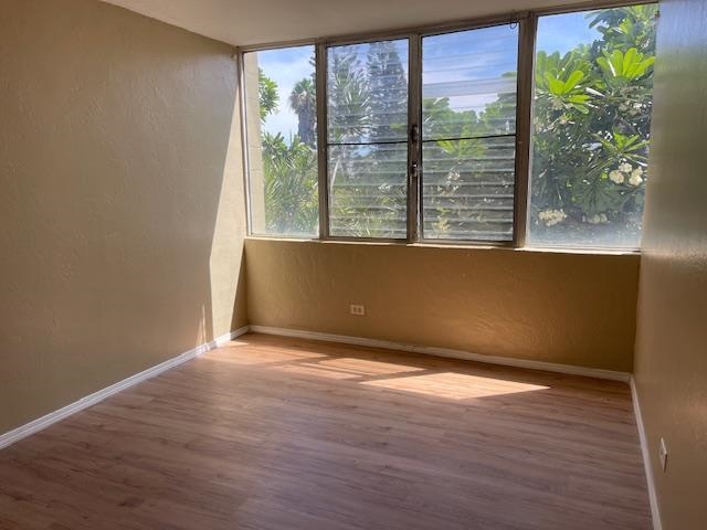 111 Kahului Beach Road, Unit C213 Kahului, HI 96732 - Photo 8 of 8 a view of an empty room with wooden floor and a window