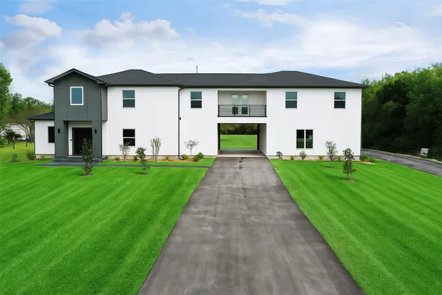 a view of staircase with lots of windows and white walls