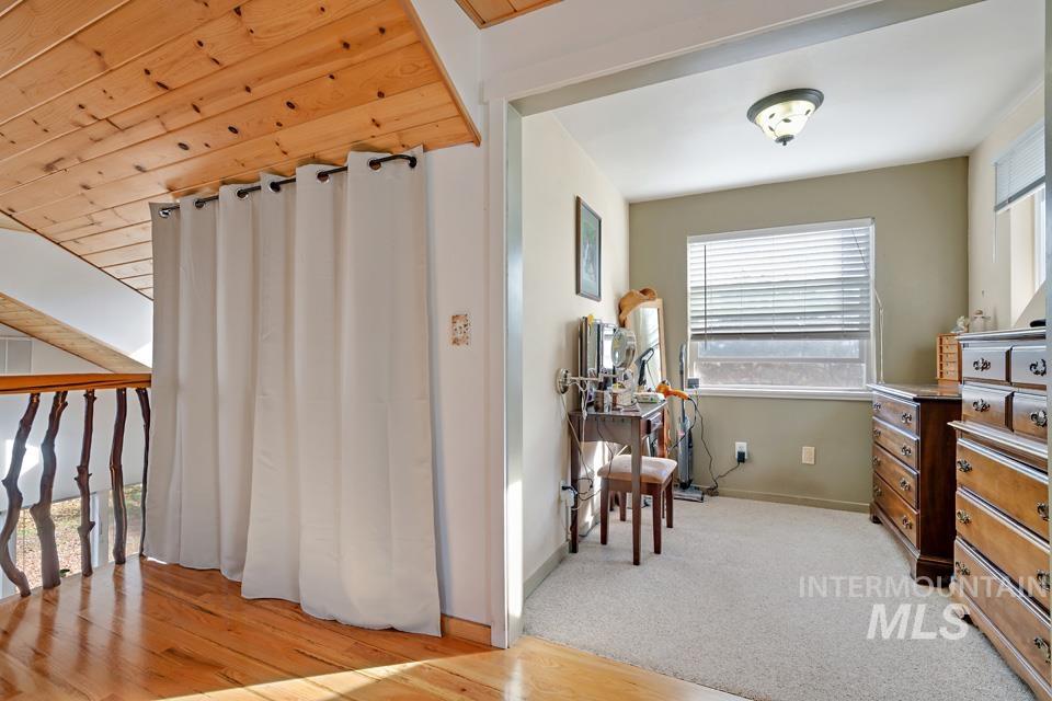 7025 Bluebird Lane Sweet, ID 83670 - Photo 28 of 46 Living area featuring light carpet and light wood-style floors