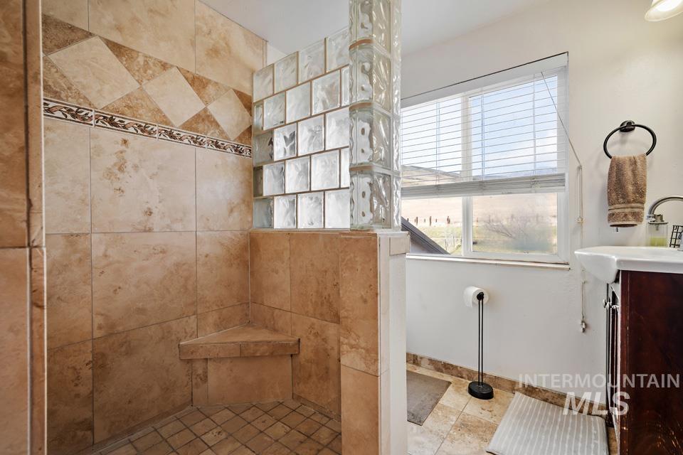 7025 Bluebird Lane Sweet, ID 83670 - Photo 29 of 46 Bathroom featuring vanity and a walk in shower