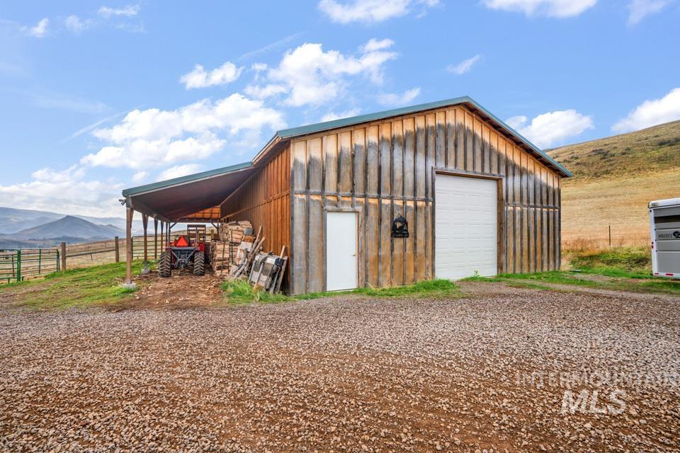 7025 Bluebird Lane Sweet, ID 83670 - Photo 5 of 46 Garage with a garage, a mountain view, and a rural view