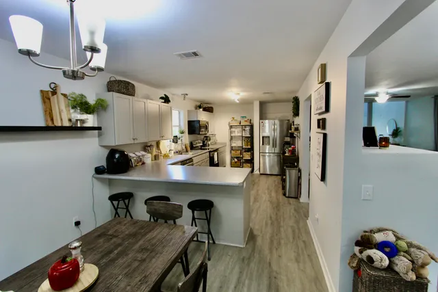 a very nice looking kitchen with wooden floor