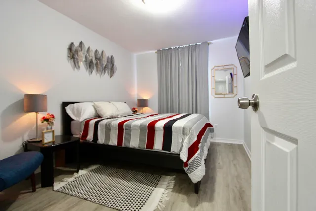 a bedroom with a bed and a walk in closet